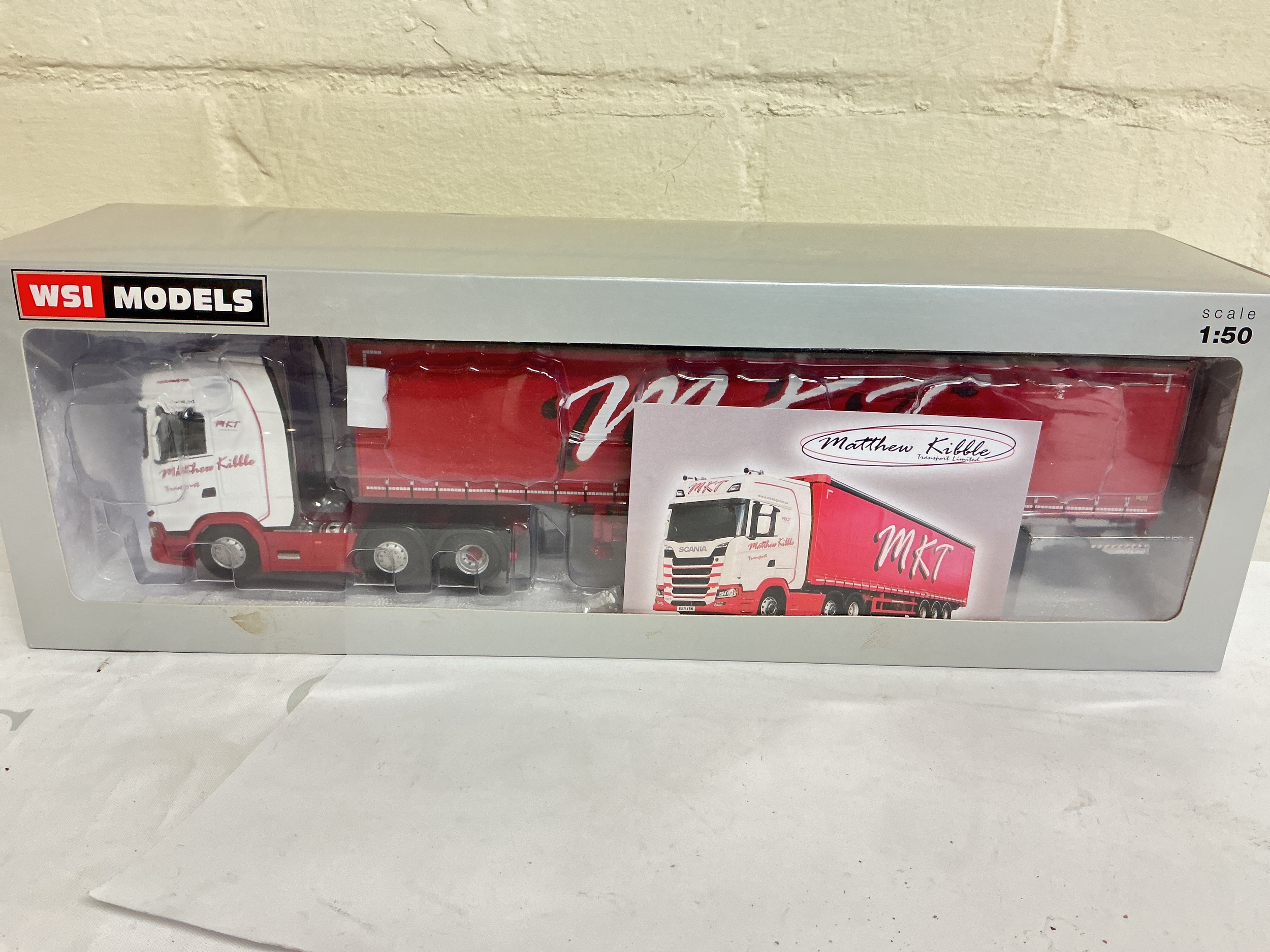 A Boxed WSI Models 1/50 Scale MKT Logistics Curtain Side Trailer 3 Axle.