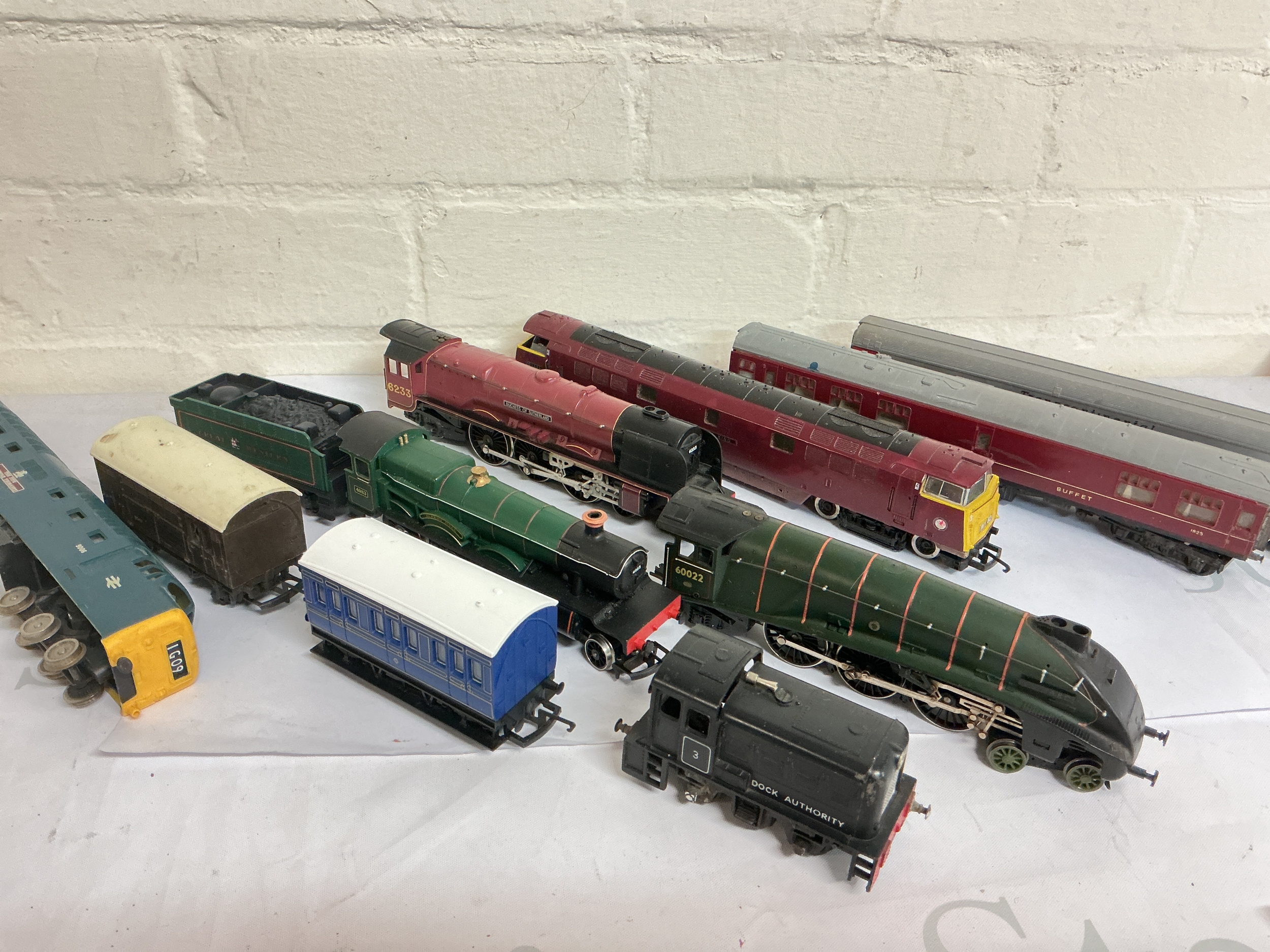 A Box Containing 00 Gauge Locomotives, coaches And Wagons. No Reserve. Ideal For Spares, Repairs. No Reserve.