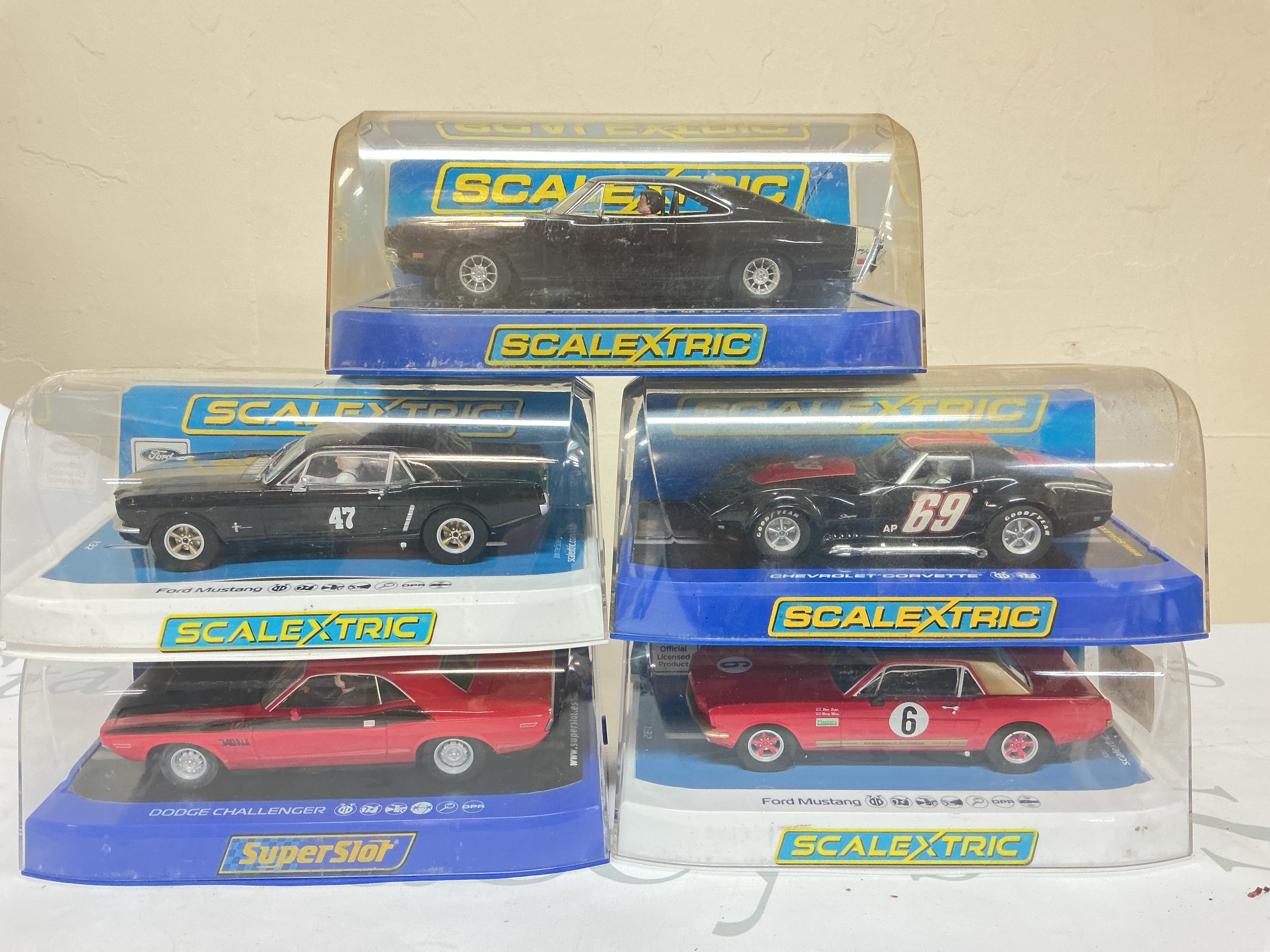 5 Boxed Scalextric Cars Including A Dodge Challenger, 2 X Ford Mustangs, A Dodge Charger, And A Chevrolet Corvette. No Reserve.
