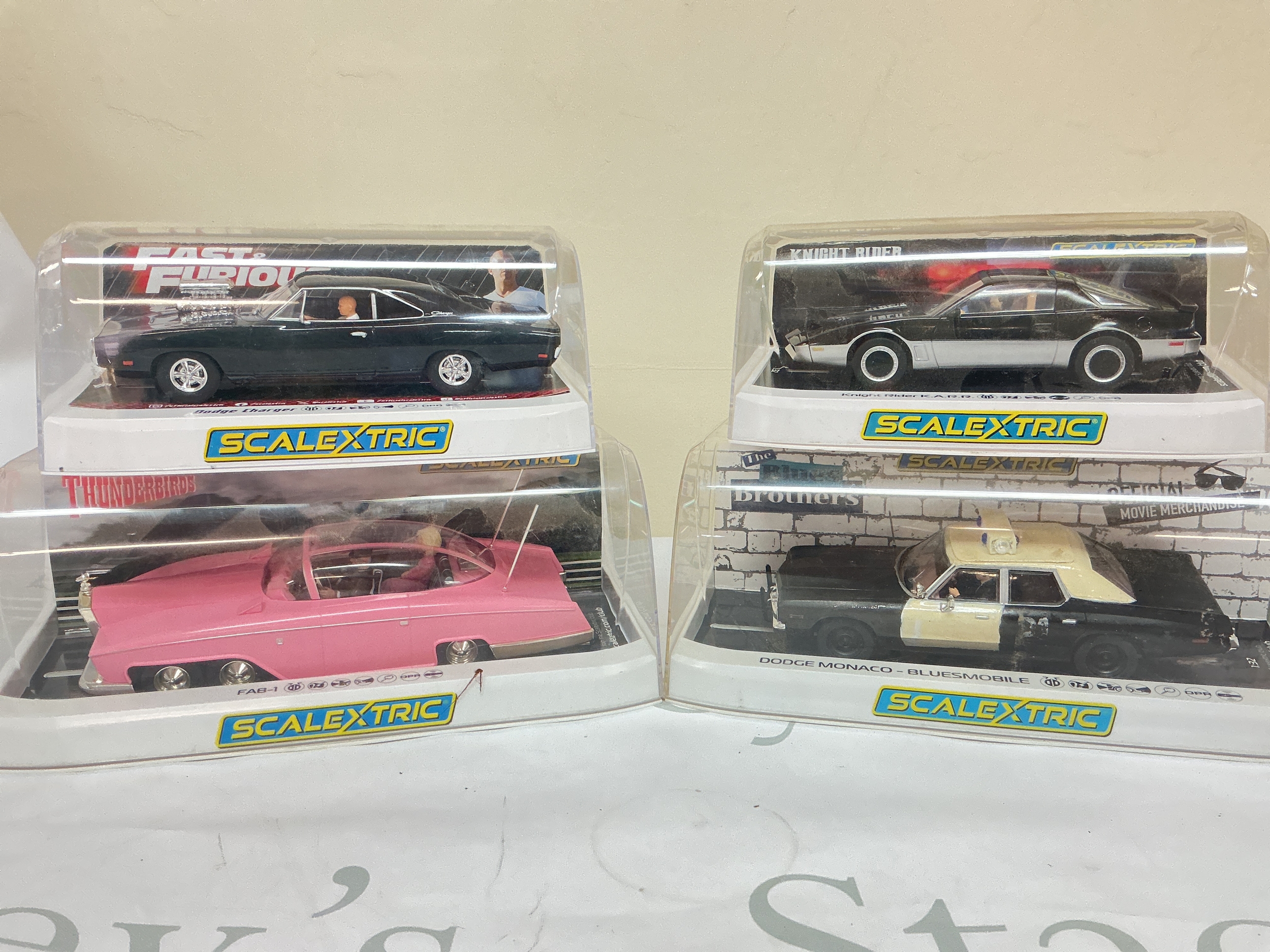 4 X Boxed Scalextric Cars, A Fast And Furious Dodge Charger, A Thunderbirds F.A.B.1 A Knight Rider K.A.R.R. And A Blues Brothers Dodge Monaco-Bluesmobile. No Reserve.