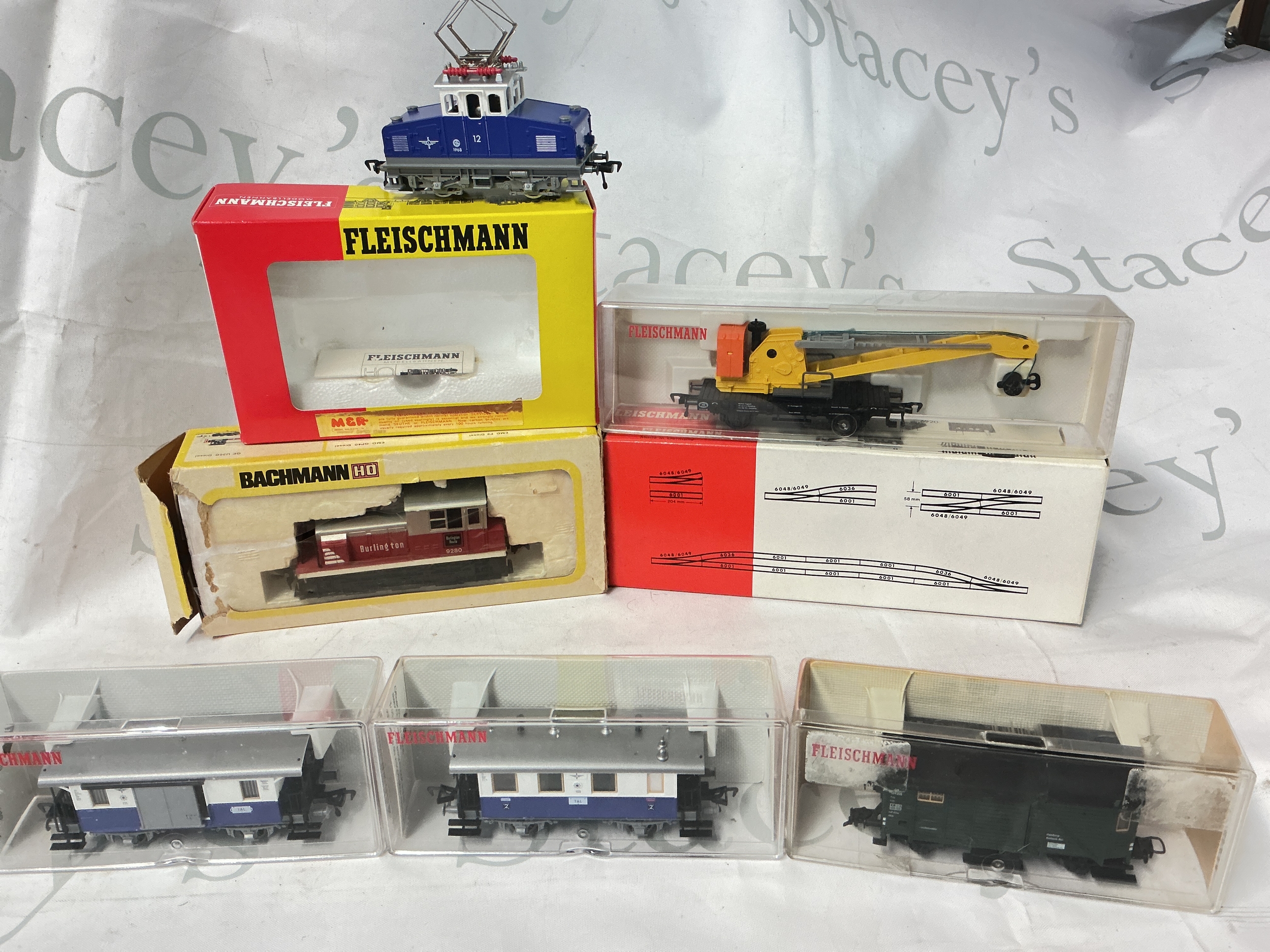 A Boxed Fleischmann H0 Gauge Edelweiss #4305, Boxed Track, A Breakdown Crane Wagon, A Bachmann 0-6-0 Diesel And 3 Coaches/Wagons. No Reserve.