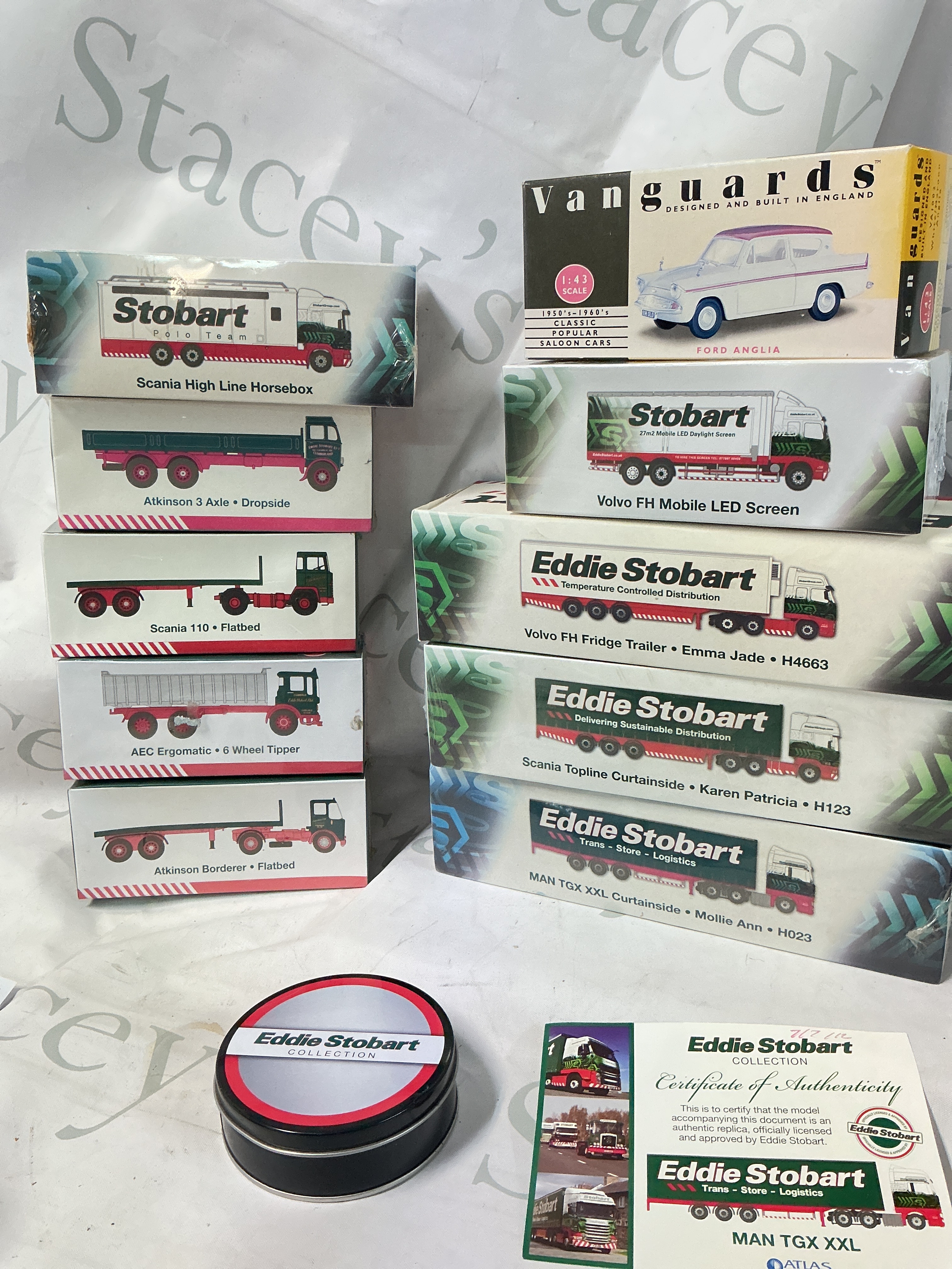 A Box Containing Boxed Atlas And Corgi Eddie Stobbart Vehicles. No Reserve.