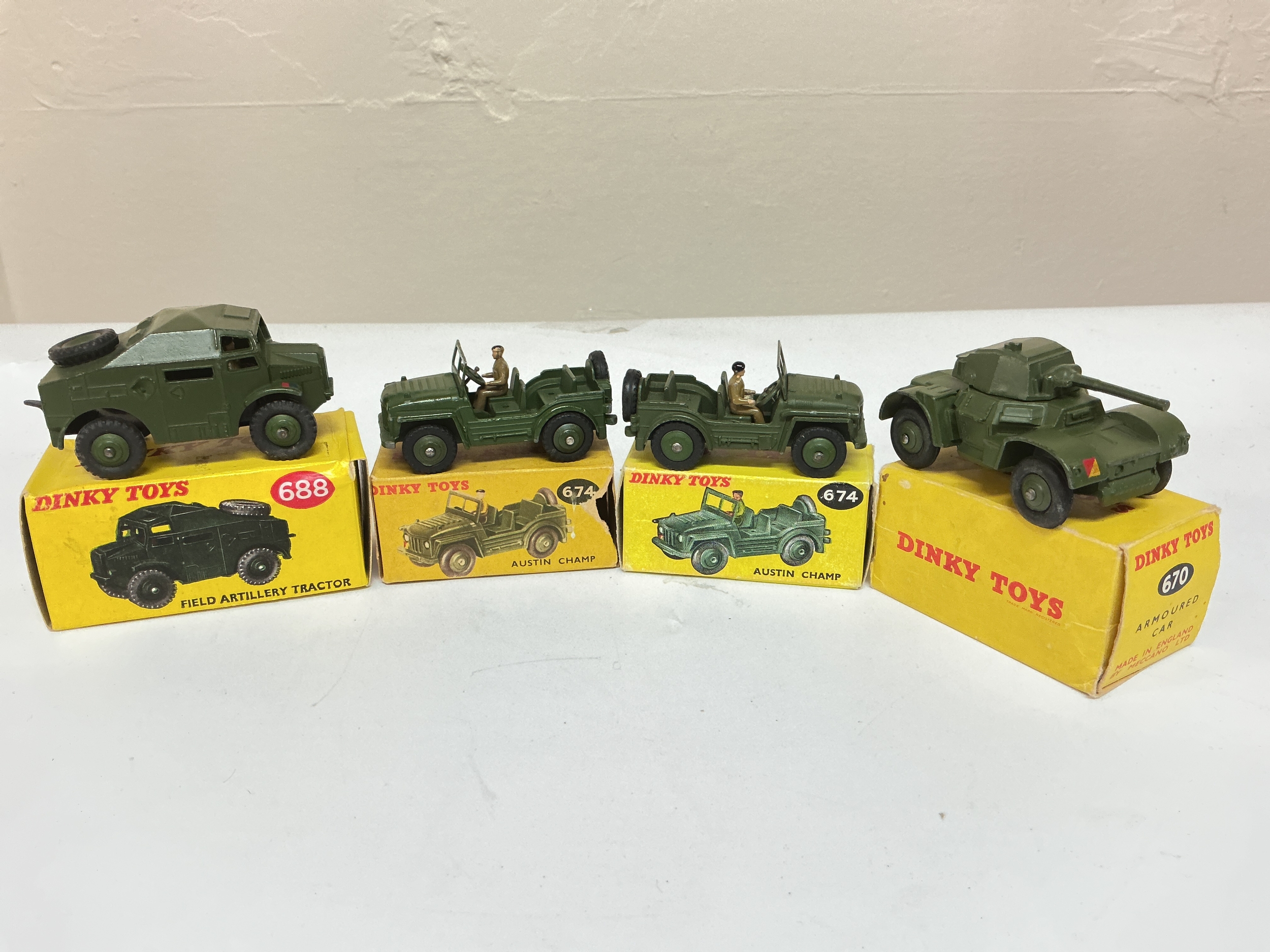4 Boxed Dinky Military Diecast Vehicles, A Field Artillery Tractor #688, 2 X Austin Champs And A Armoured Car #670
