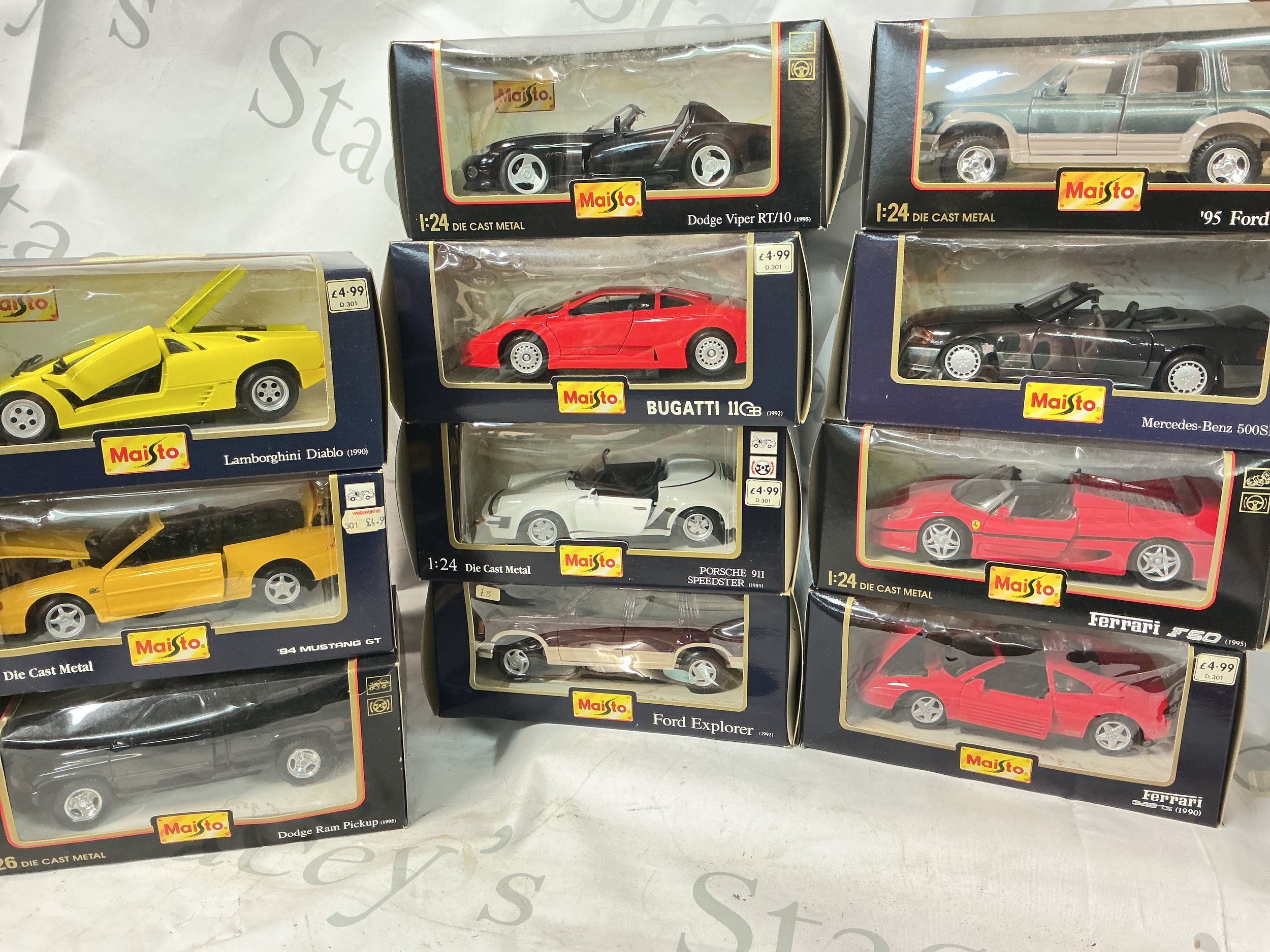 11 Boxed Maisto 1/24, 1/26 Scale Diecast Cars. No Reserve.