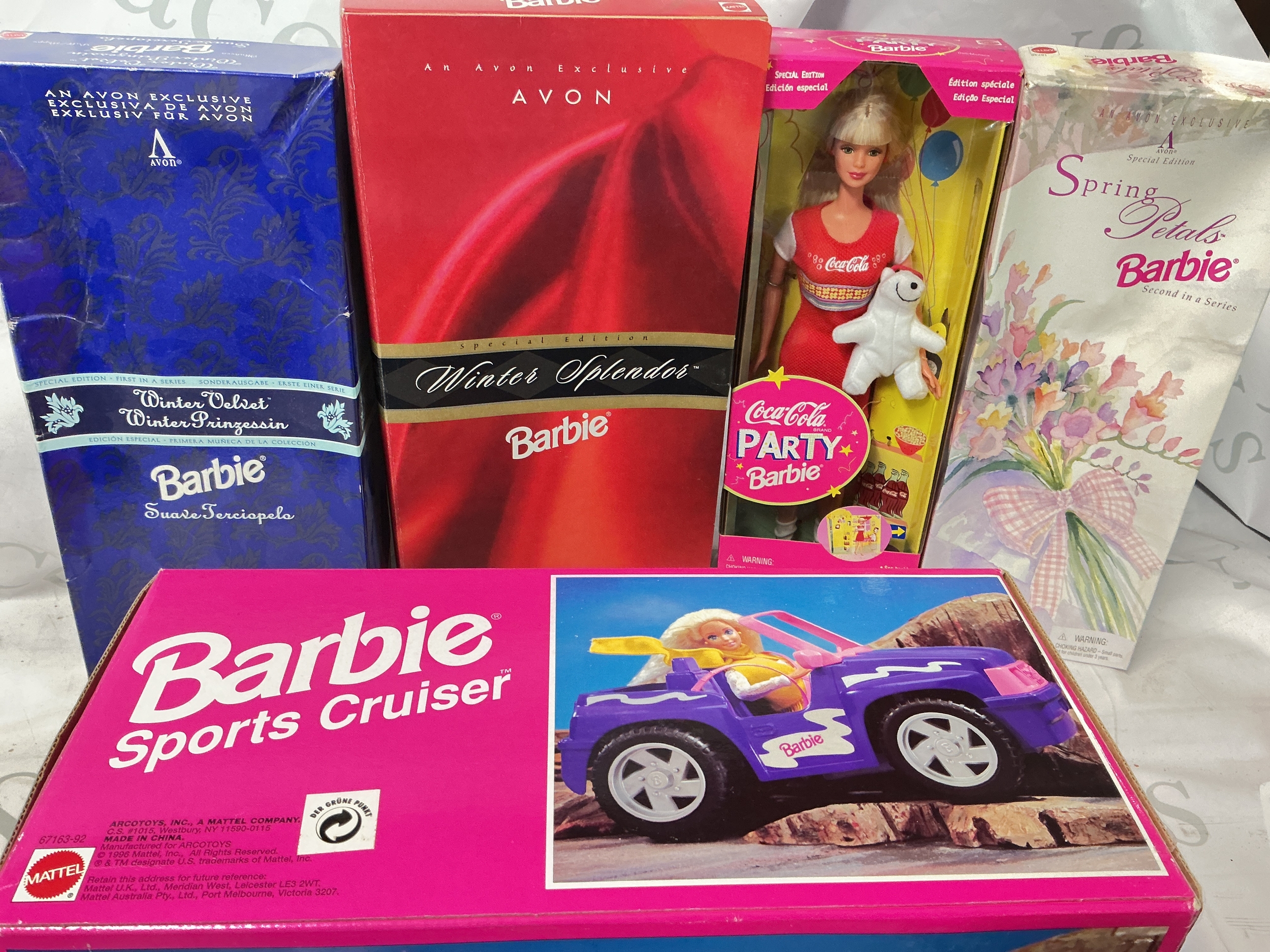 4 Boxed Barbies And A Barbie Sports Cruiser. A Spring Petals Barbie, A Coca-Coca Party Barbie, A Winter Velvet And Winter Splendor. 