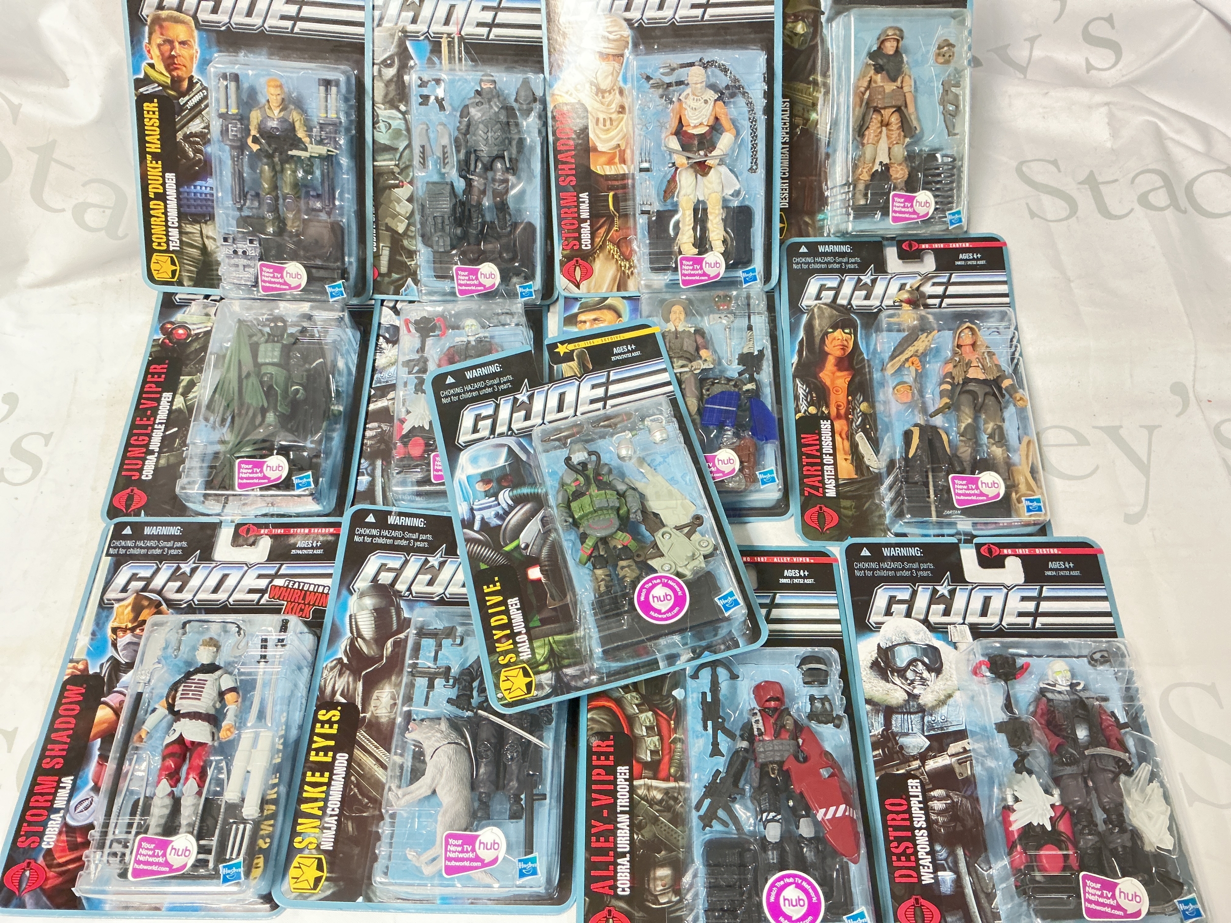 A Collection Of 13 Modern G.I. Joe Figures And 2 Vehicles. No Reserve.
