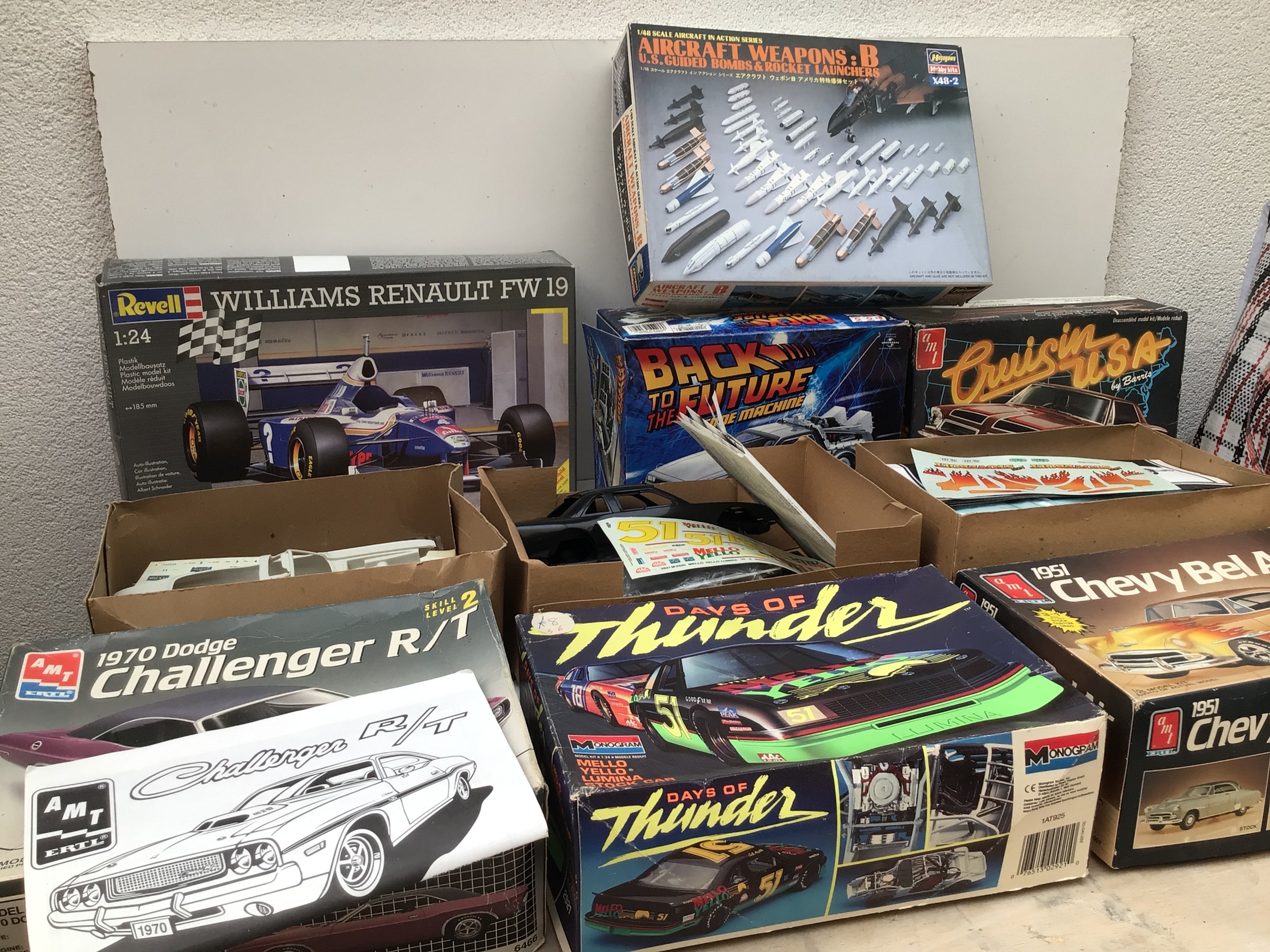 Bag containing a collection of boxed model kits by various manufacturers including AMT, Revell, Airfix etc.  Collection features aircraft and planes in various scales.  No reserve.