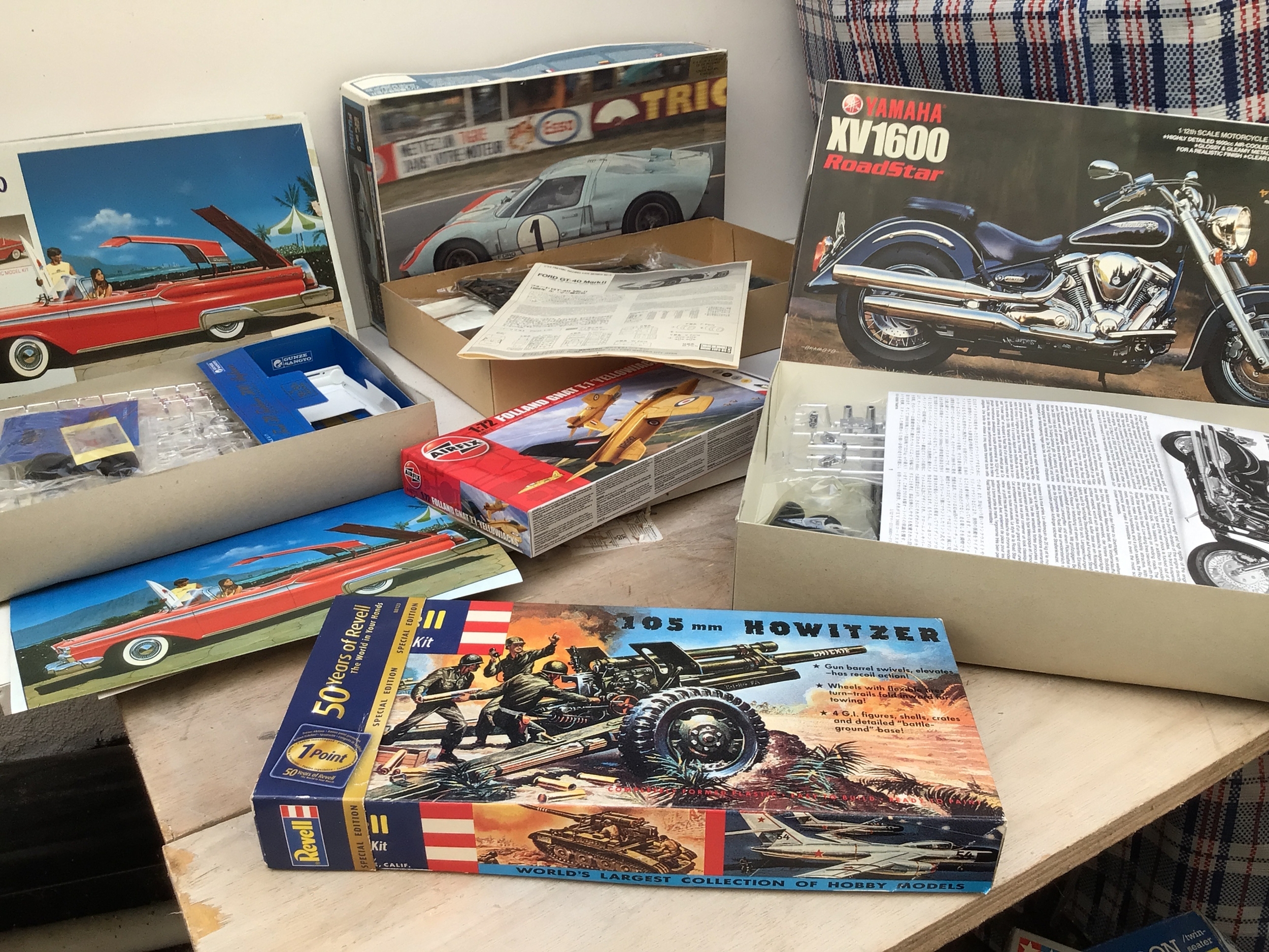 A bagged collection of boxed model kits by manufacturers including Revell, Tamiya, Airfix etc.  Collection consist of mainly aircraft and cars in varied scales.  No reserve