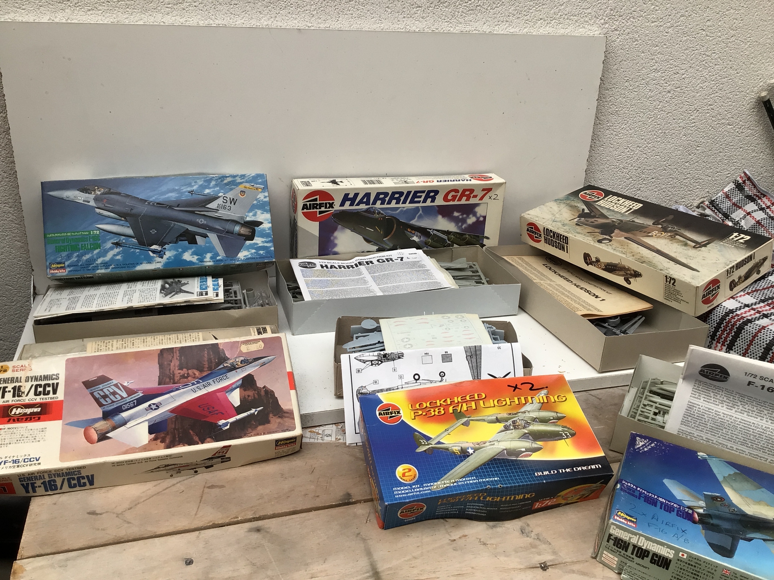 A collection of boxed model kits model kits comprising aircraft and tanks.  Manufacturers include Airfix, Hasegawa, Kitech  in varied scales.  Some kits contain multiple models.  No reserve