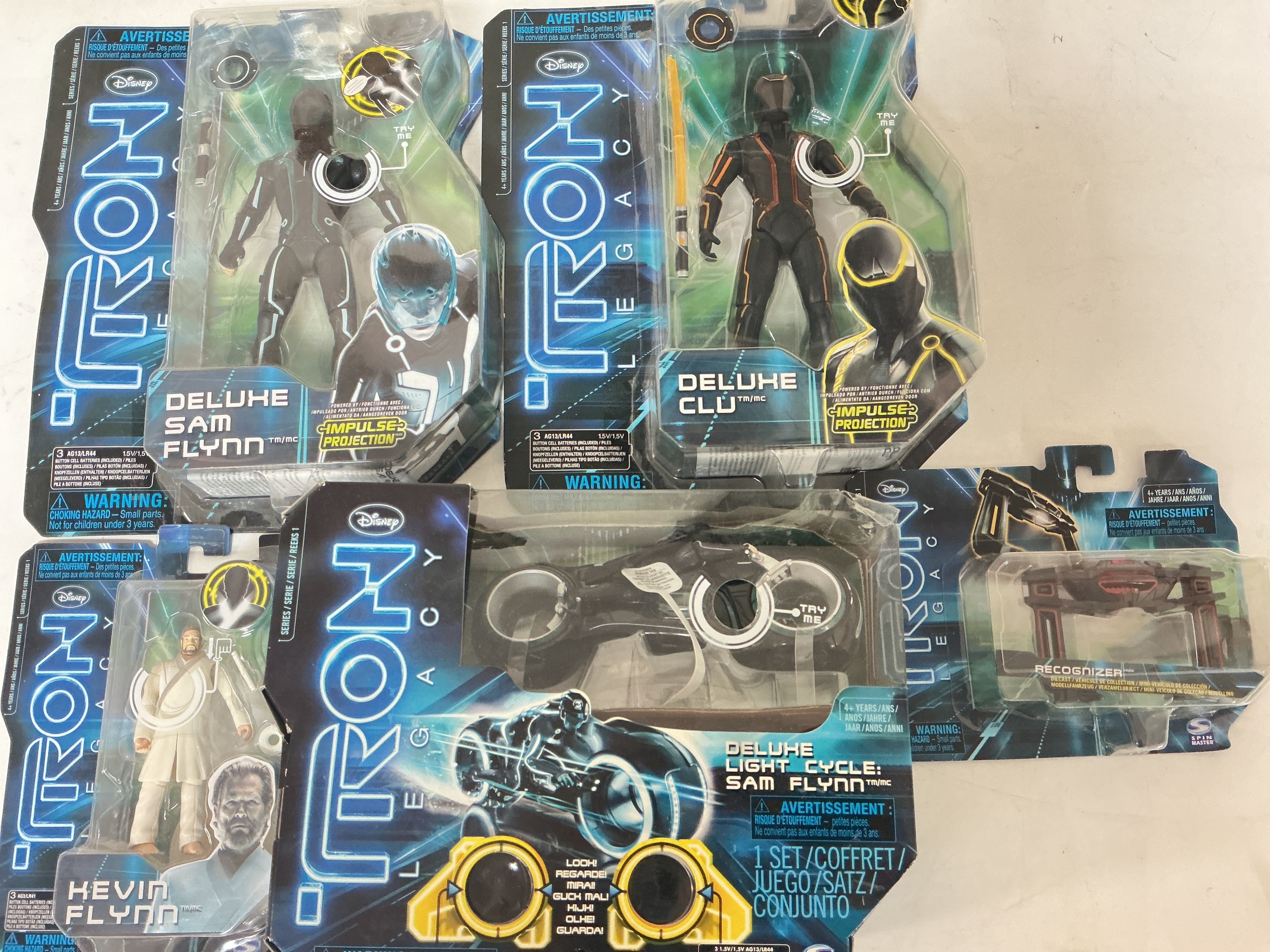 A Small Collection Of Boxed Tron Legacy Toys. No Reserve.