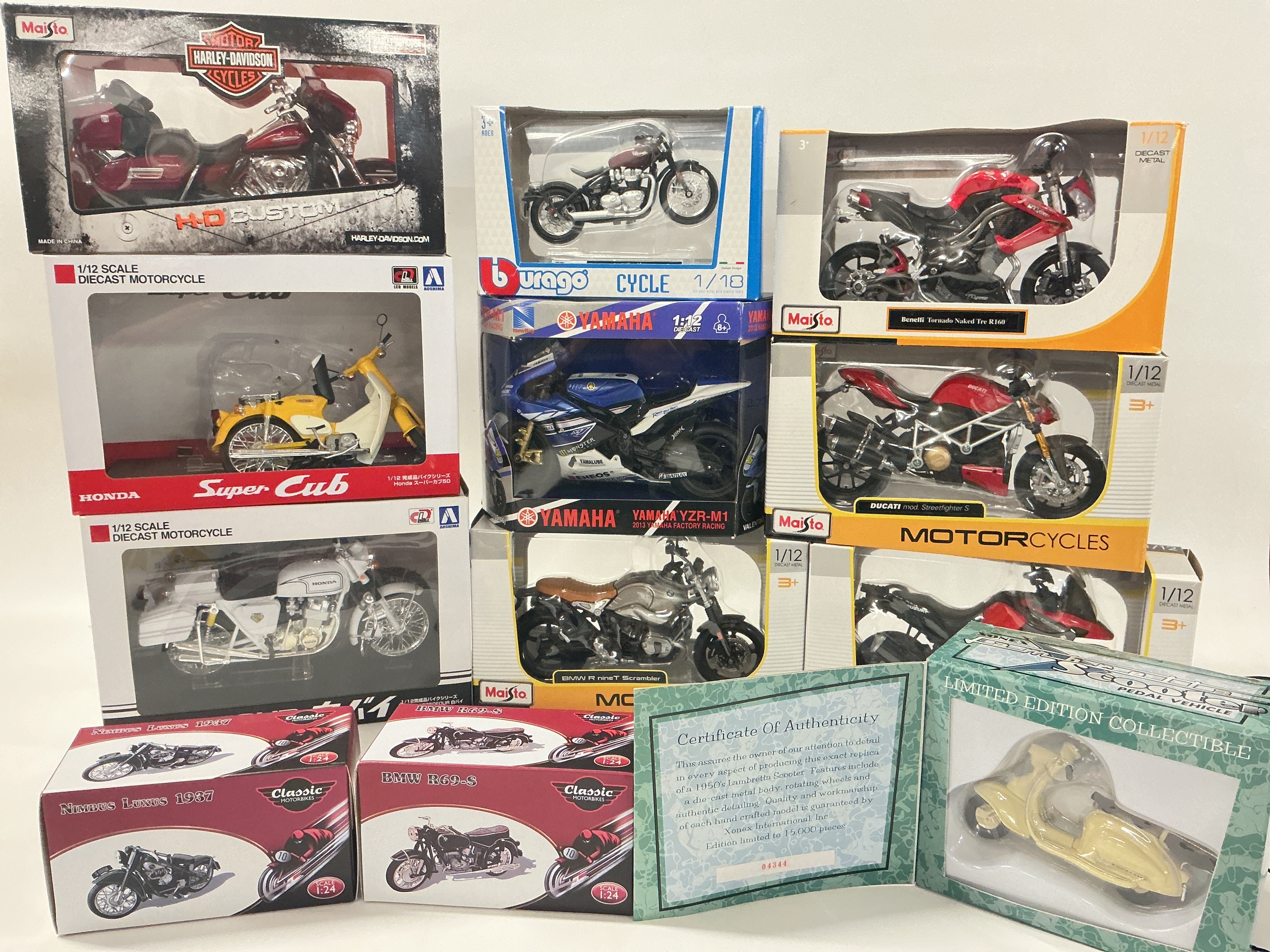 A Collection Of Boxed Diecast Motorcycles, Including Maisto, Burago, Atlas Etc. No Reserve.