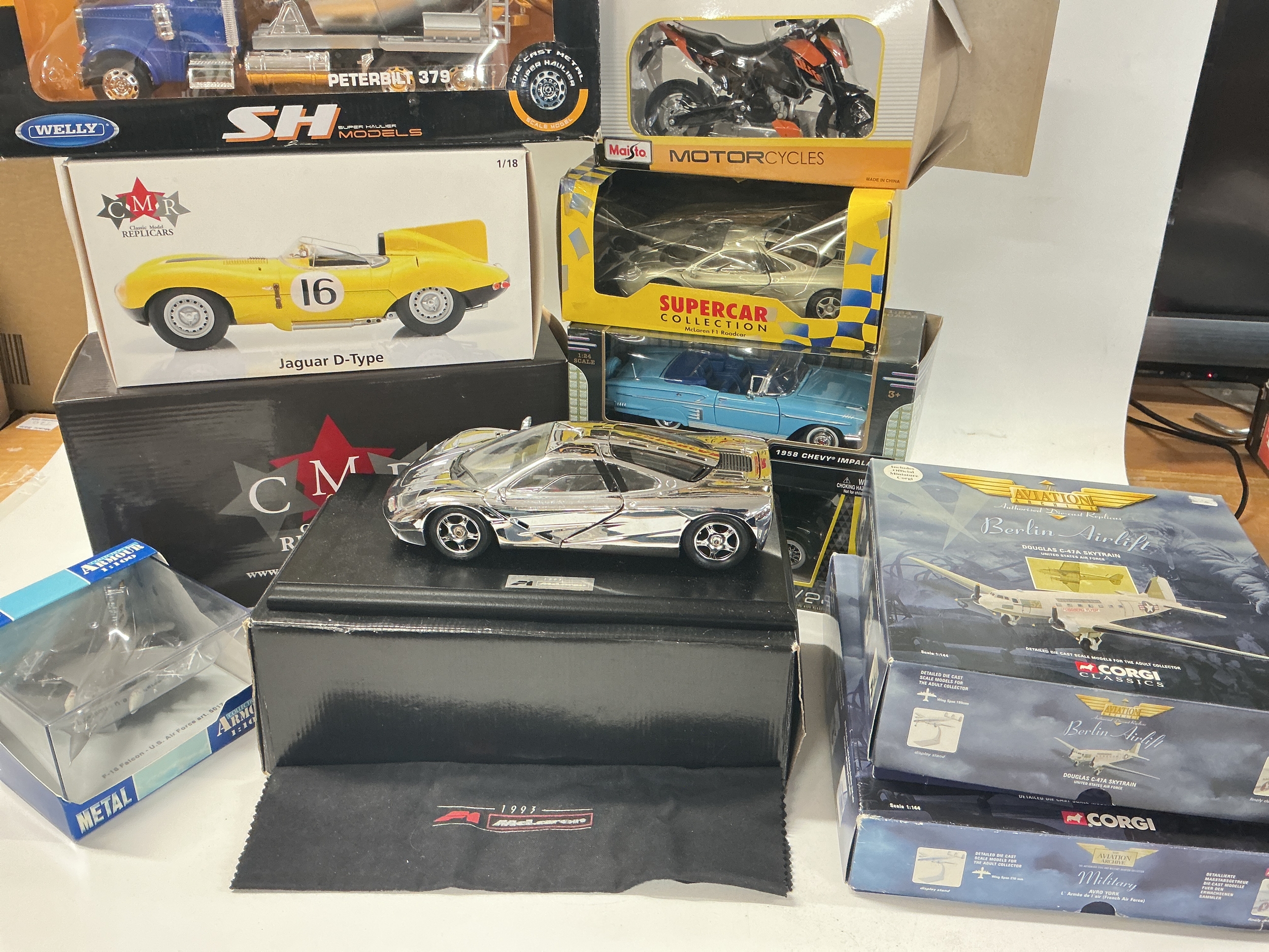 A Collection Of Boxed Diecast Including A Maisto McLaren 1/18 Scale Chrome-Plated F1 Car. Corgi Avaiation Archives Are Both At Fault.(2).