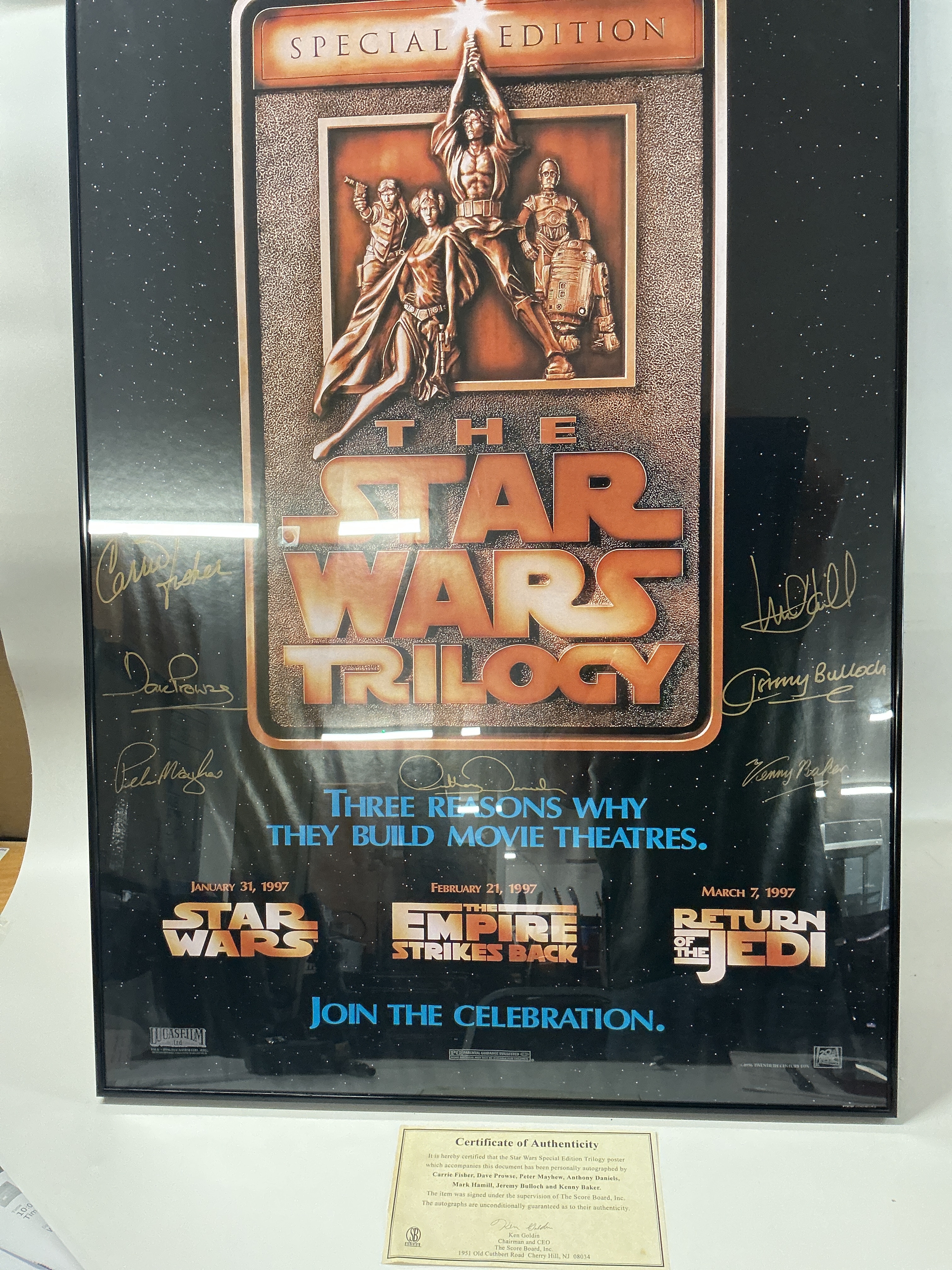 A Framed Star Wars Special Edition Poster Signed By Carrie Fisher, Dave Prowse, Peter Mayhew, Anthony Daniel's, Mark Hamill, Jeremy Bulloch And Kenny Baker. With Certificate. Approximate Size 92Cm X 62Cm. No Reserve.
