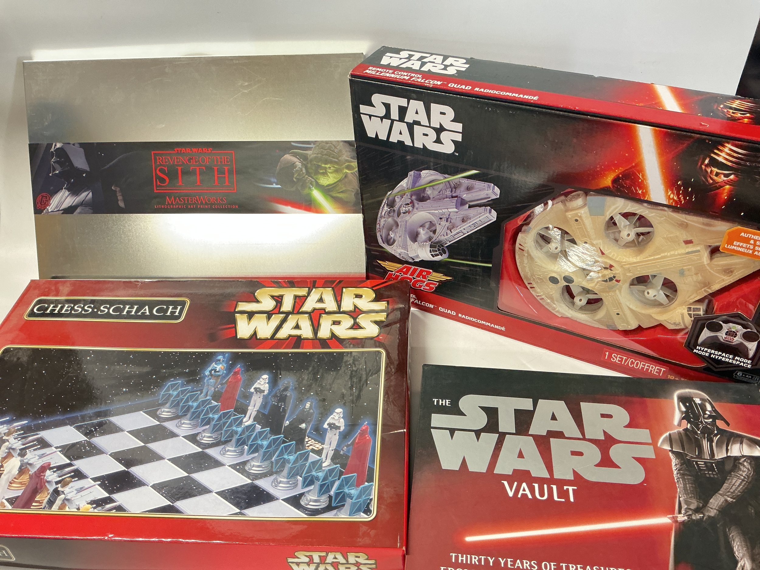 A Collection Of Various Star Wars Ephemera Including A R/C Falcon, Chess Set, Puzzles, watches, trading Cards, coins,Phone Cards Etc.