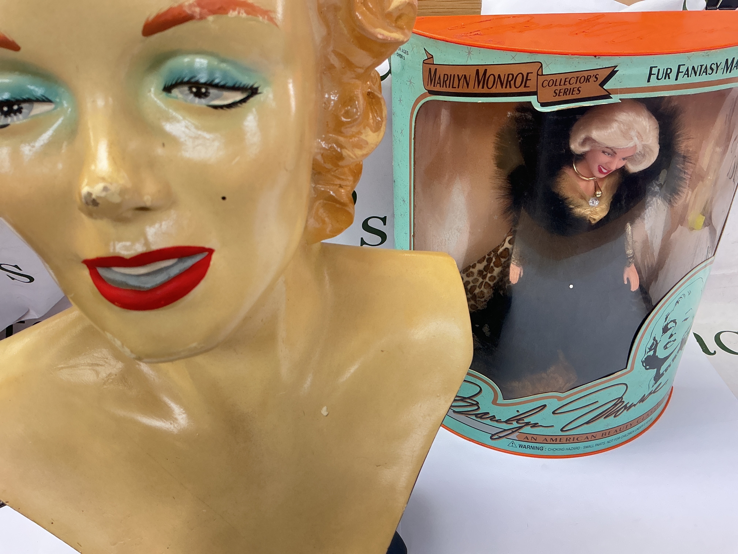 A Collection Of Marilyn Monroe Items Including A Fibreglass Bust, Boxed Doll And Franklin Heirloom Dolls. No Reserve.