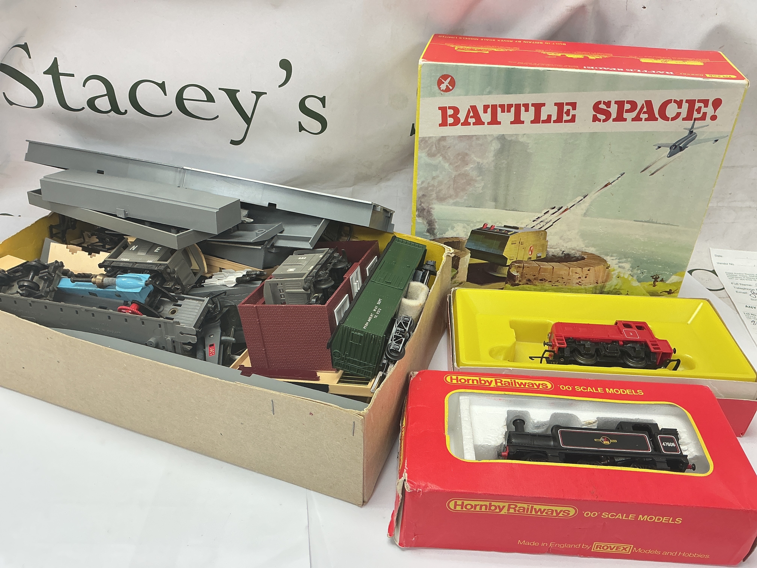 A Box Containing Tri-Ang 00 Gauge Locomotives And Accessories.