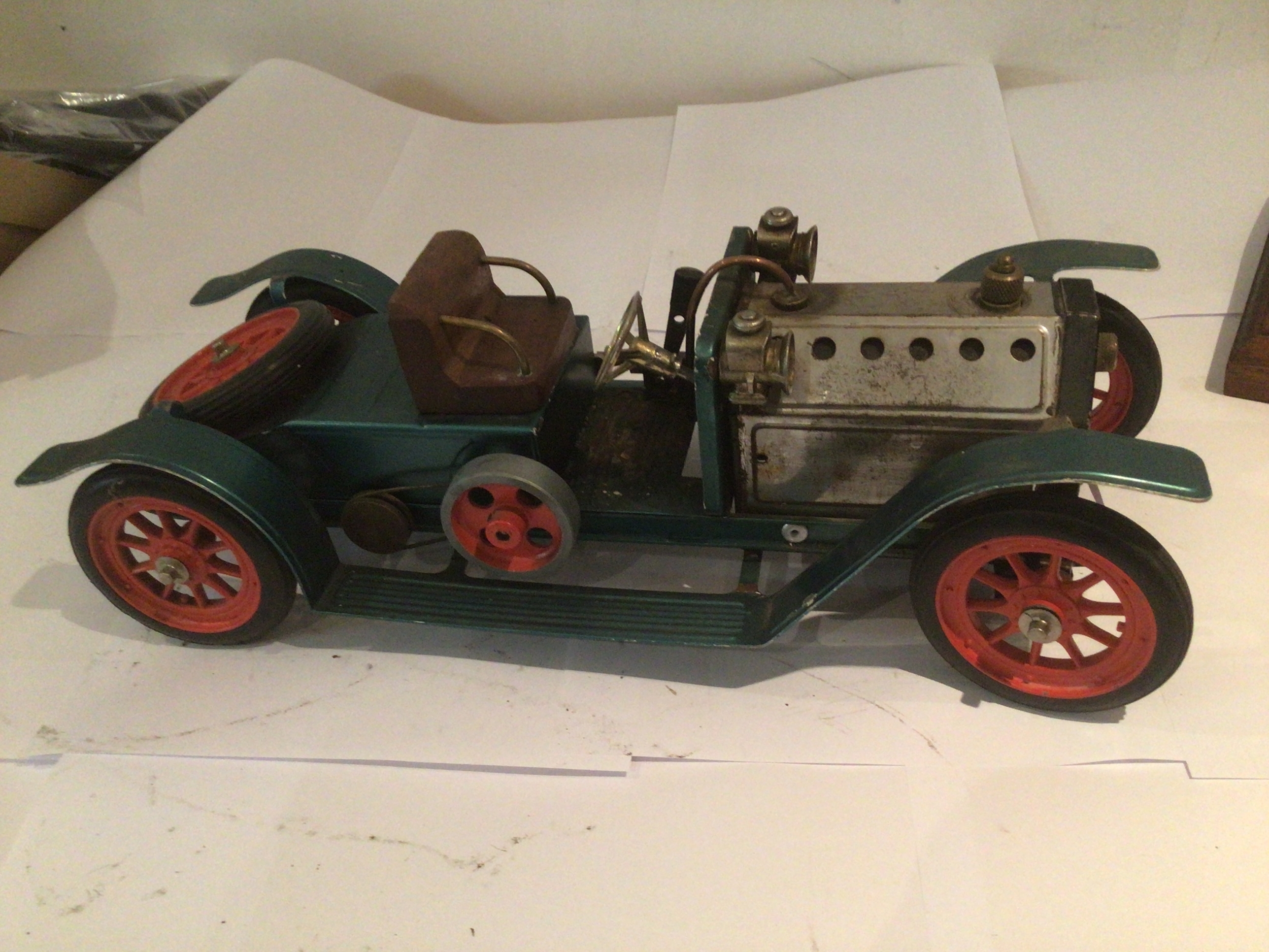 A model steam vintage roadster car by Mahmod or Wilesco.  Untested