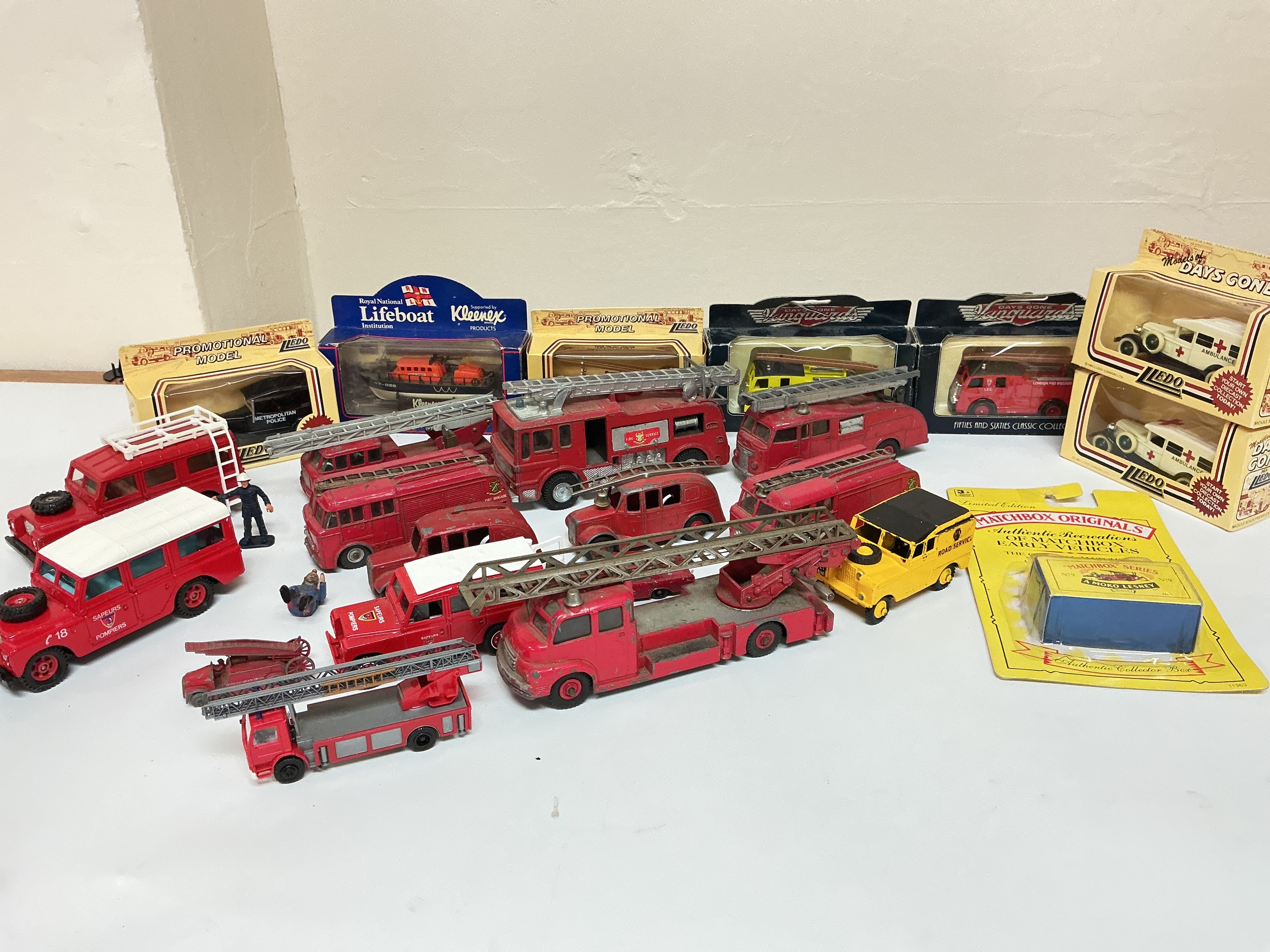 A Collection Of Playworn Dinky Fire Engines Plus Other Loose And Boxed Diecast Emergency Vehicles.