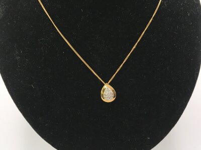 An 18ct gold necklace with diamond pendant.