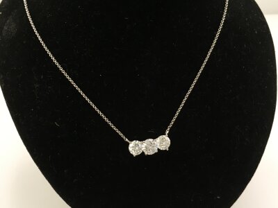 A 9ct white gold necklace set with three large CZs
3.39g
