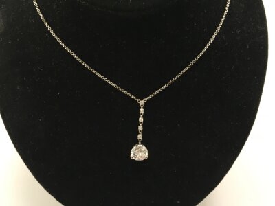 A 9ct white gold necklace with a CZ pendant.
2.94g