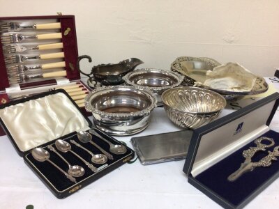A collection of silver plate cased cutlery wine coasters dishes and other items in two boxes.