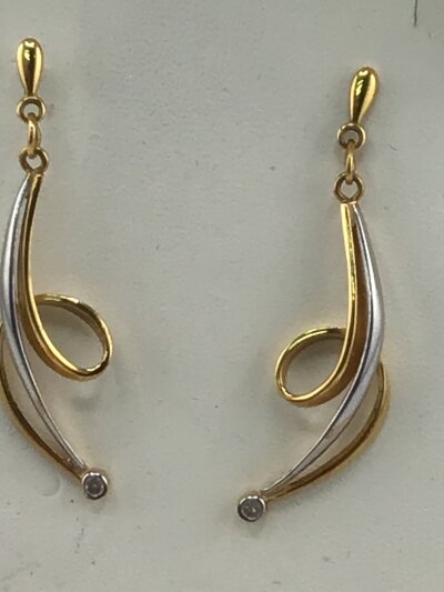 A pair of 9carat white and yellow gold long drop earrings. Weight 3.5g