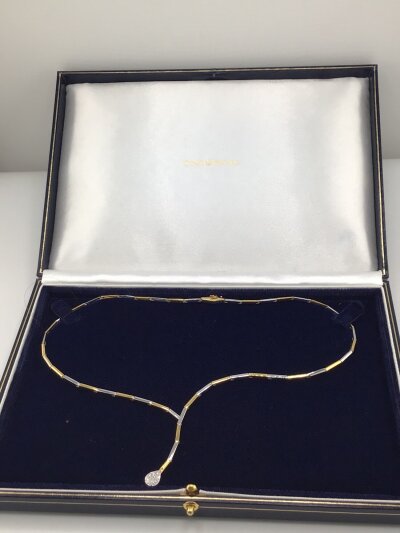 A Quality Goldsmiths 18carat gold yellow and white gold necklace with solid alternating links set with a diamond set pear-shaped drop in a fitted box. Weight 15g