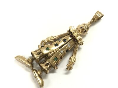 A 9ct gold animated clown stone set pendant, approx weight 30.27. Approx height 9cm.