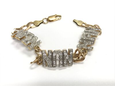 A 9ct gold NAN CZ set curb bracelet, approx length 8 inches.