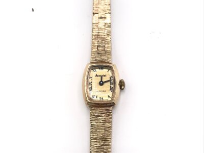 A 9ct gold ladies watch. Both case and strap are 9ct.
18.58g