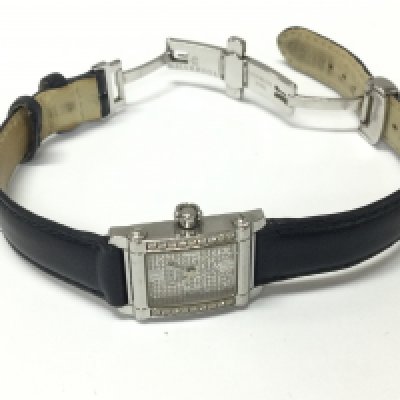 A Charriol diamond ladies watch on black leather strap.
