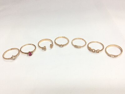 Seven 14ct rose gold diamond set rings, 10.3G total weight. Size N,O