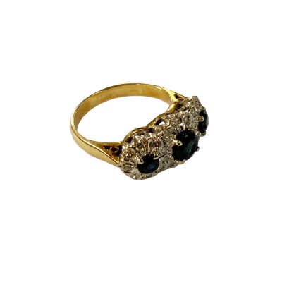 A vintage 18ct yellow and white gold sapphire and diamond ring.