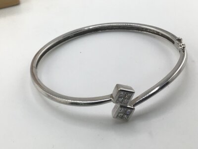 An 18carat white gold modern design bracelet pave set with diamonds. Weight 15g