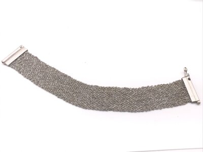 An 18ct white gold Matt finish wide chain mail type bracelet.
Approximately 18.5cm length and  29.28g
