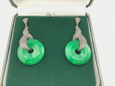 A pair of jadeite earrings in fitted box.
Approximately 52mm long and 25mm wide,
