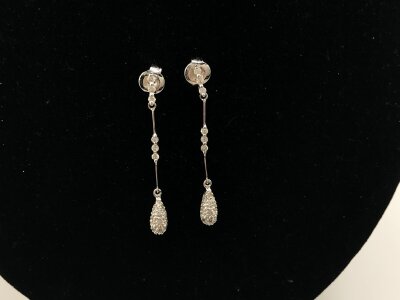 A pair of 18ct white gold modern style long drop earrings.
2.46g