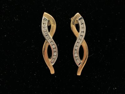 A pair of 9ct white and yellow gold earrings set with white stones.
