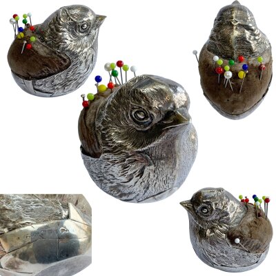 An Edwardian silver novelty chick hatching from an egg pincushion, 6cm high, Rd. 475678, Sampson Mordan & Co. Chester. Worn marks.