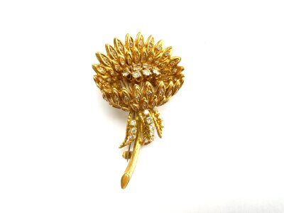 A good quality 18ct yellow gold and diamond set chrysanthemum design brooch, 17.8g.