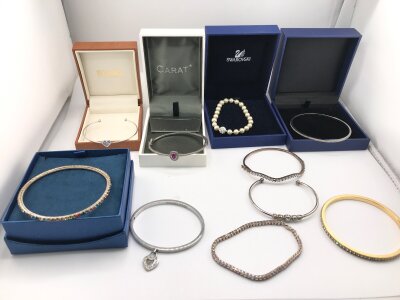 A collection of assorted bangles and bracelets.