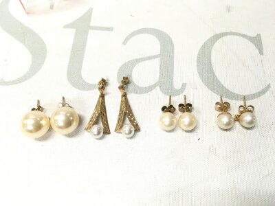 Four pairs of pearl set 9 carat gold earrings. 6.1g total weight.