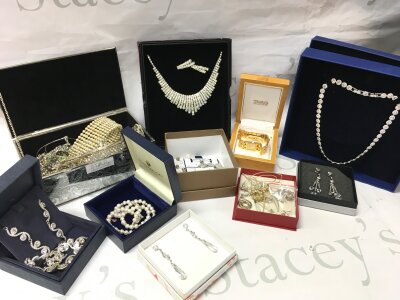 A collection of costume jewellery including a boxed Swarovski necklace , earrings, Raymond Weil watch, necklaces, bracelets