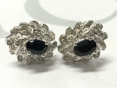 A pair of 9 carat white gold diamond and sapphire earrings. 4.3G total weight