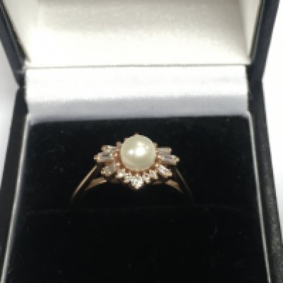 A 14ct rose gold diamond and pearl ring, approx 3g and approx size M. Shipping category A.