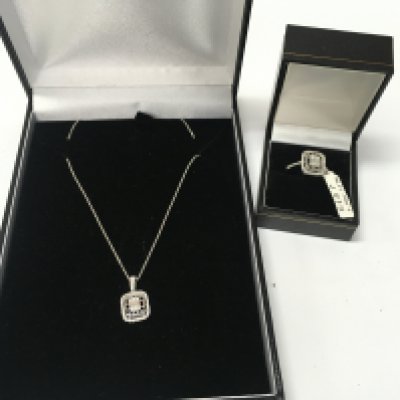 A 14ct white gold and diamond pendant chain and ring. Ring is size N