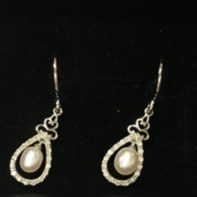 9ct white gold pearl and diamond earrings. Postage A