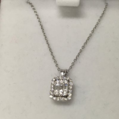 A 14ct white gold diamond solitaire square necklace.