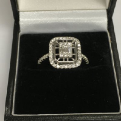 A 14ct white gold diamond cluster ring, approx 3.5g and approx size M-N. Shipping category A.